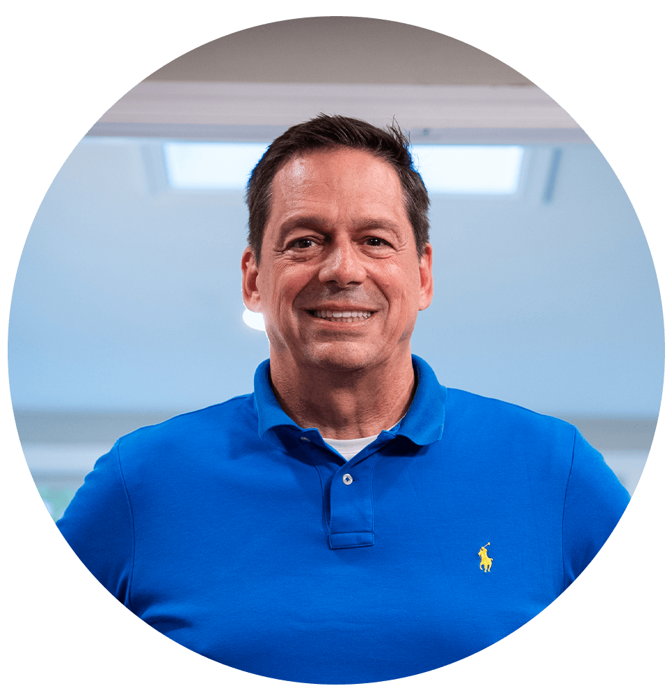 headshot of patient smiling brightly after their dental implant procedure