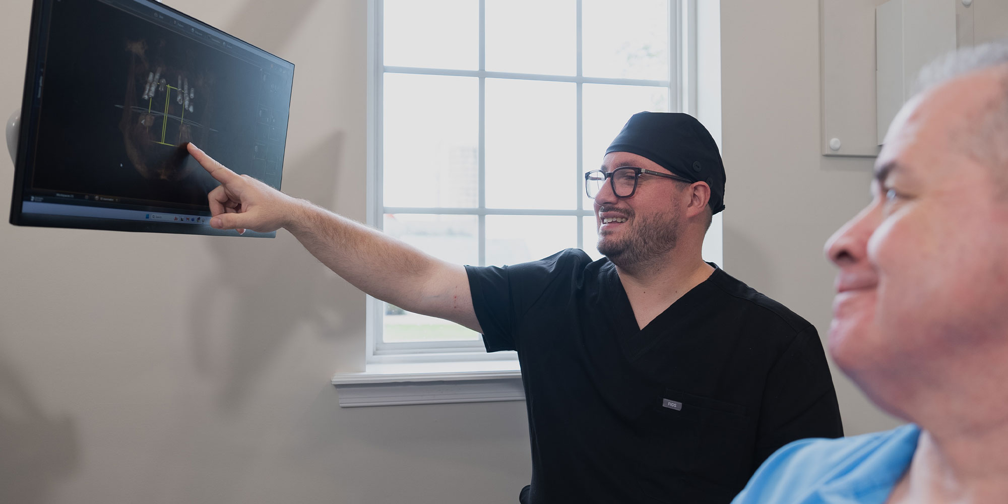 doctor going over dental treatment information