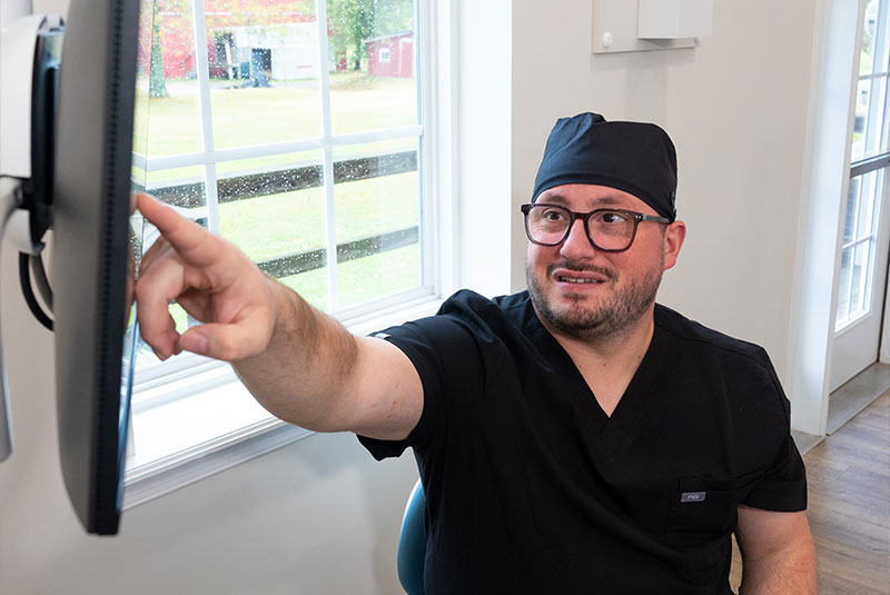 doctor going over dental procedure information with patient