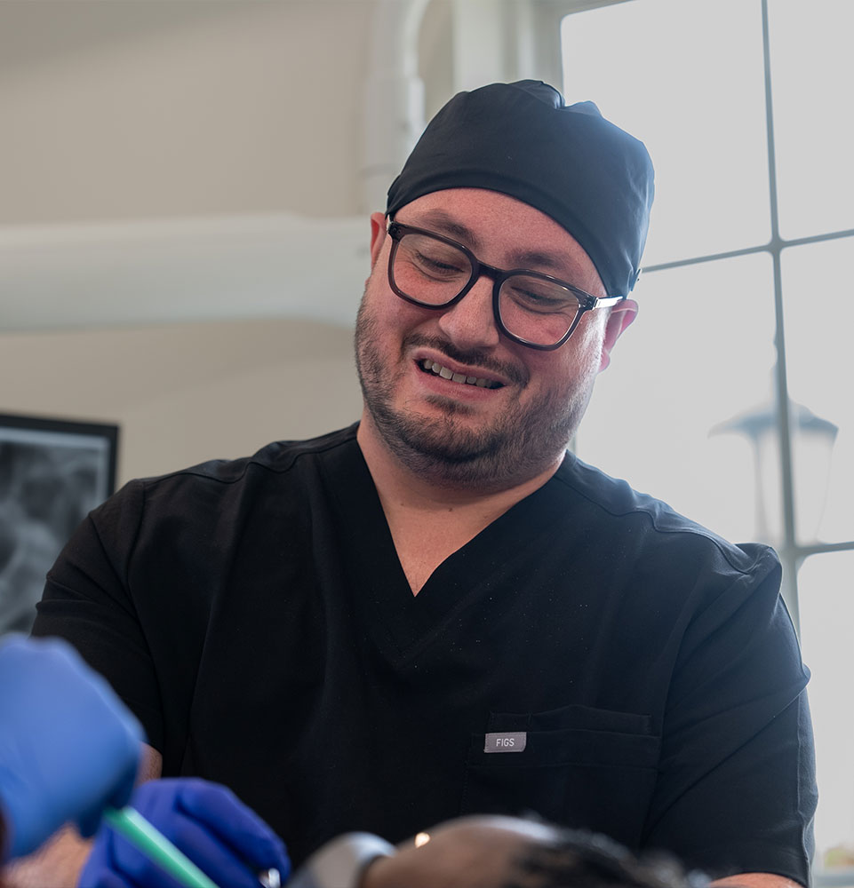doctor performing lanap procedure on dental patient