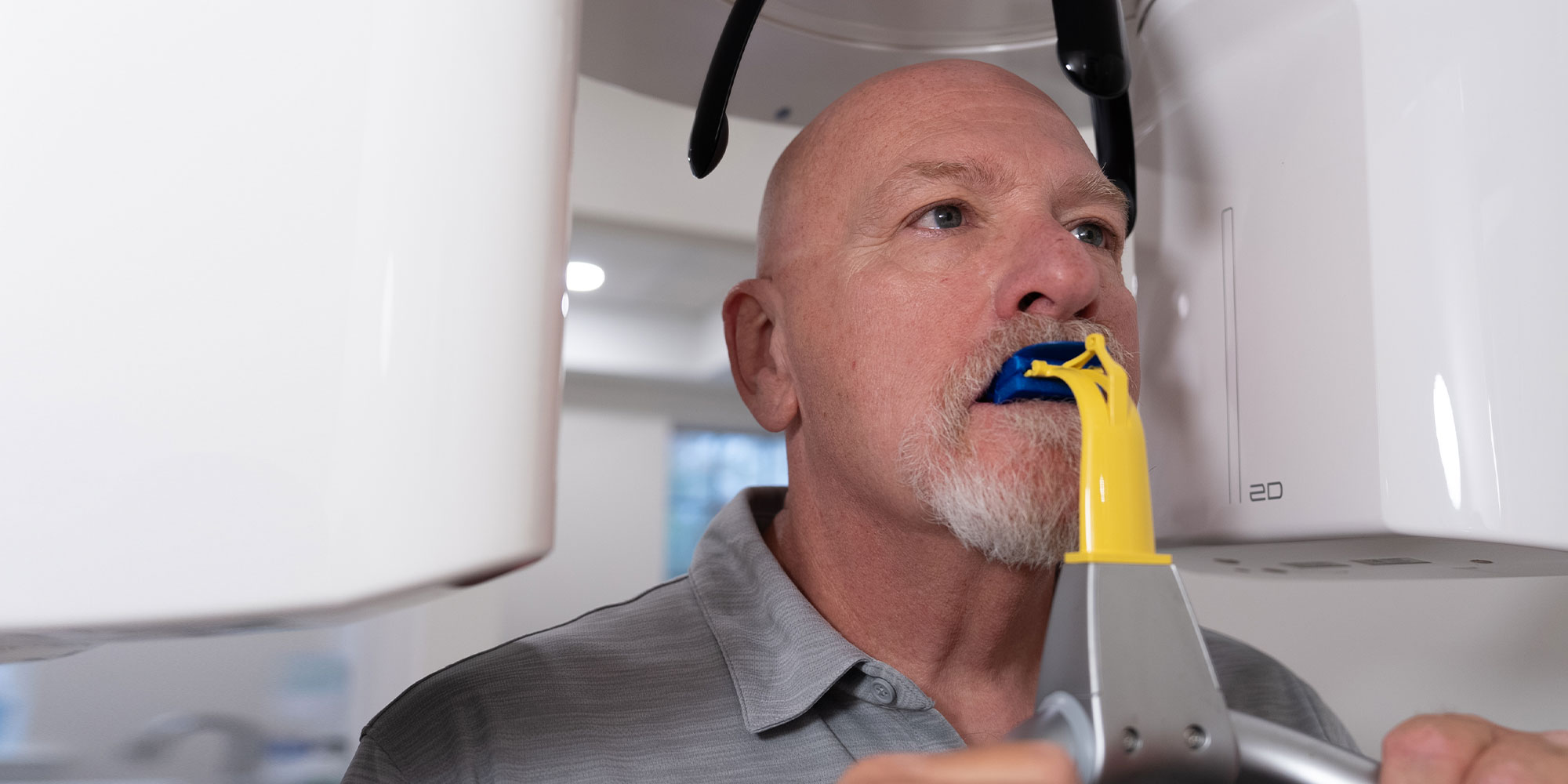 patient undergoing a cbct scan for their dental procedure