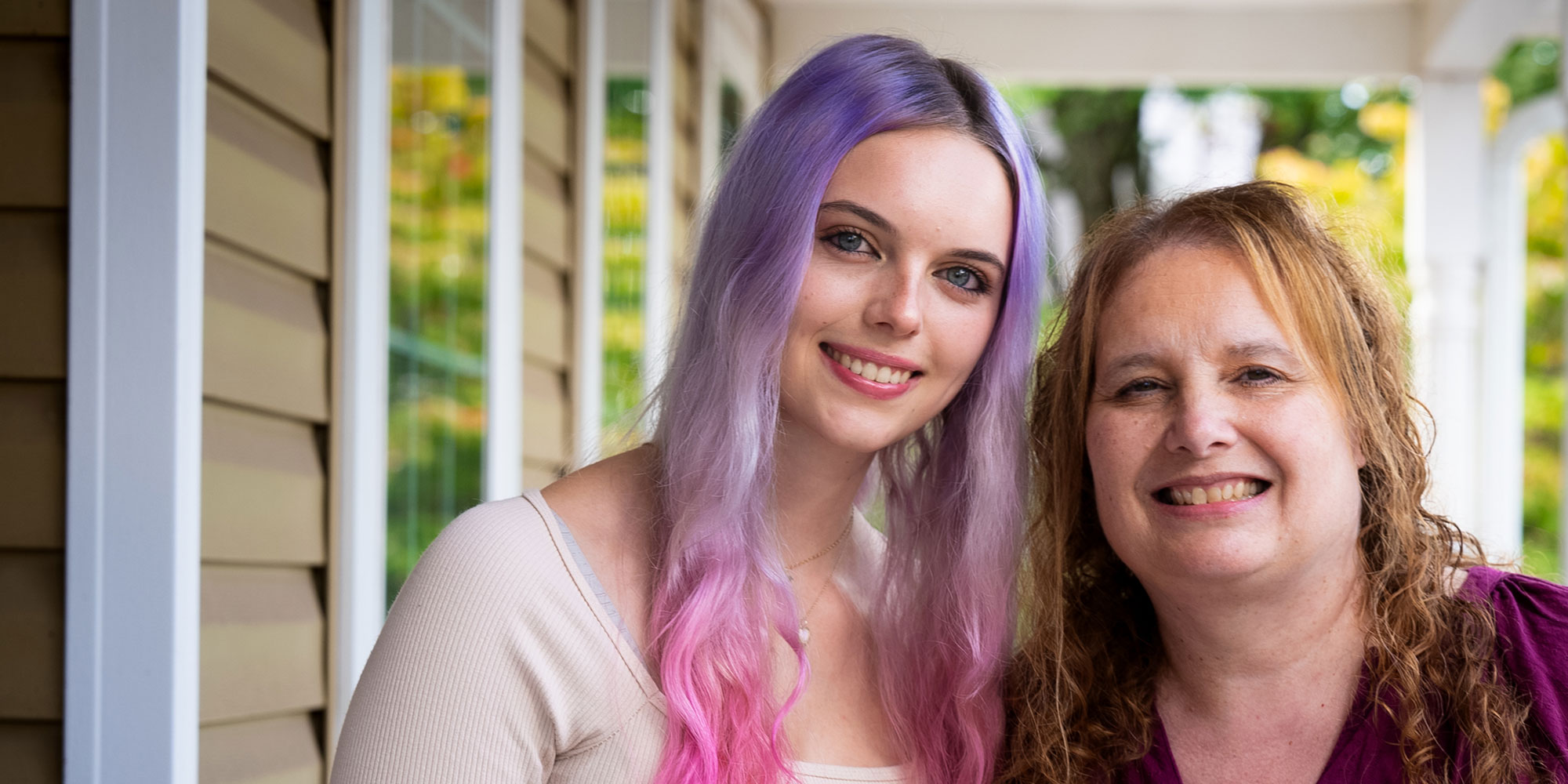 patient smiling brithly after their dental treatment within the dental room